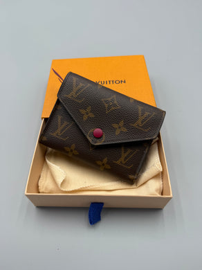 Louis Vuitton Victorine monogram wallet with pink interior
