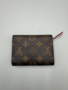 Louis Vuitton Victorine monogram wallet with pink interior