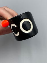 Load image into Gallery viewer, Chanel Black/White Resin Coco Cuff Bracelet