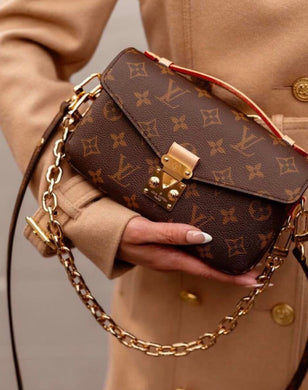 Louis Vuitton East West Pochette metis monogram with strap and chain